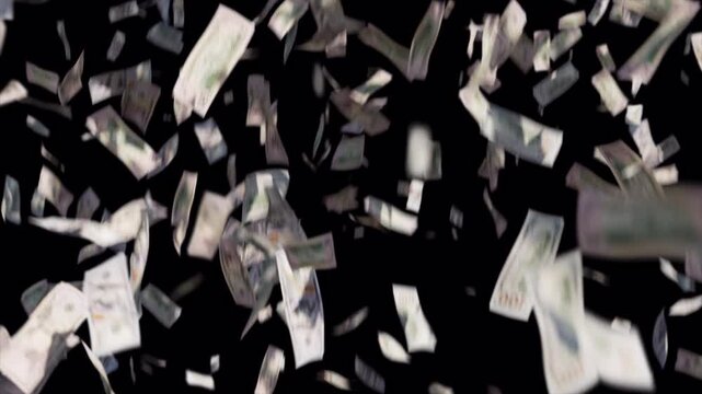 Abstract background of paper money falling against a solid black backdrop.
