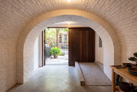 View Up Garage Ramp From Brownstone Basement to Tree Lined Street