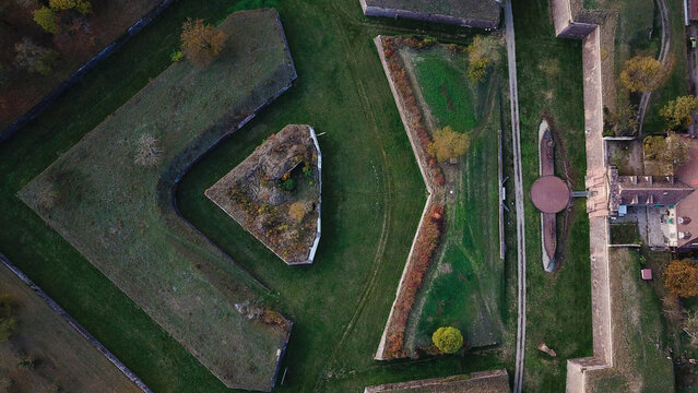 Aerial view of the Vauban walled city of Neuf-Brisach with its distinctive star-shaped fortifications, stone ramparts, and autumn trees in Neuf-Brisach, Grand Est, France.