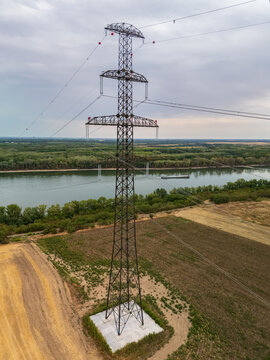 Aerial view of Danube power lines near Ercsi with farmland and boats below