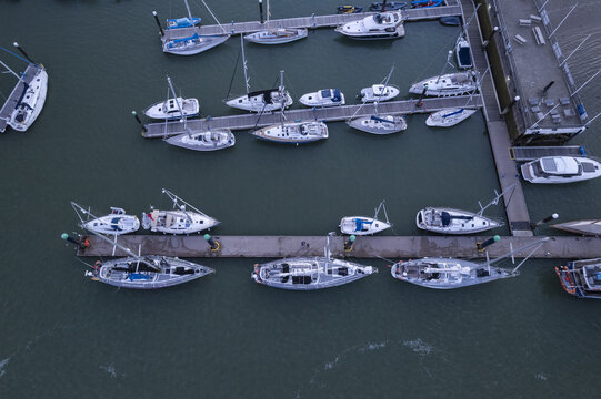 Aerial view of sailboats and motorboats moored at the marina in Cowes, England, United Kingdom.