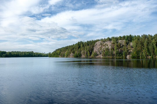 Scenic summer landscape of Yastrebinoe Lake and Parnas Cliff in Karelia, Russia, with copy space.