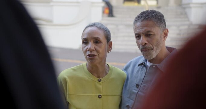Mature Couple Window Shopping in City
