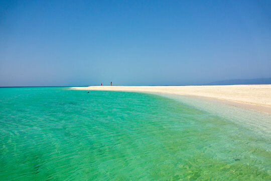 Beach walkers on white sand spit, Dahlak Archipelago, Eritrea