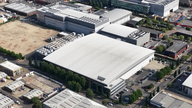Aerial drone view of Slough industrial estate in the UK, featuring a major cluster of data centers, power infrastructure and facilities supporting AI, cloud computing and digital services.