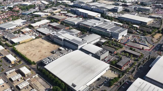 Aerial drone view of Slough industrial estate in the UK, featuring a major cluster of data centers, power infrastructure and facilities supporting AI, cloud computing and digital services.