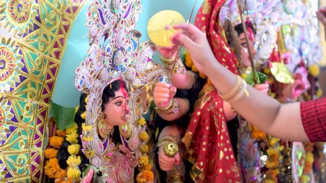 People Celebrating Durga Puja Festival with devi Durga.Durga Puja is a religious festival of Hinduism that is celebrated across the globe.