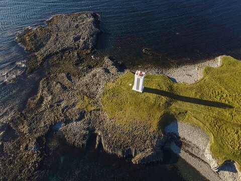 Lighthouse and coastal landscape with basalt formations, K&aacute;lfshamarsv&iacute;k, Skagi Peninsula, Iceland
