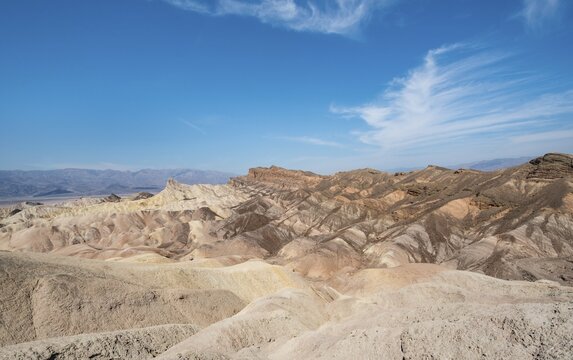 Badlands, rock formations at Zabriskie Point, behind Panamint Range, Death Valley National Park, California, USA