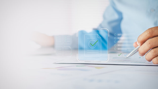 Businessman reviewing and approving electronic documents with digital checklist and checkmark icons on white desk, concept of document approval, compliance, and paperless workflow.