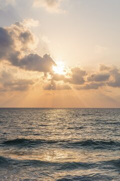 Sunset over the sea, clouds with sunrays, Tel Aviv, Israel