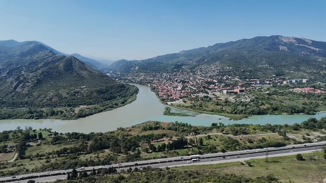 Panoramic video view of Mtskheta at the confluence of the Mtkvari and Aragvi rivers, surrounded by green mountains and valleys in Georgia. Mtskheta and River Confluence in Georgia