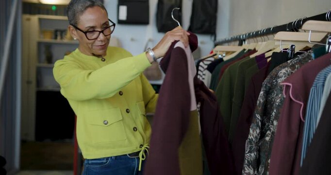 Senior Woman Shopping for Clothes in Store