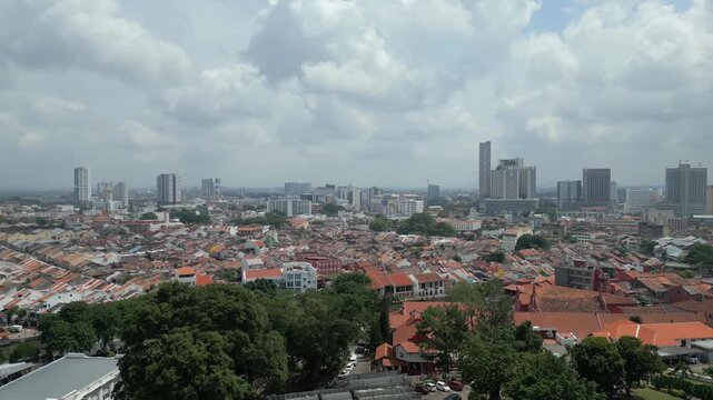 Aerial view of the historic city skyline with dense rooftops and modern buildings in Malacca, Malacca, Malaysia.