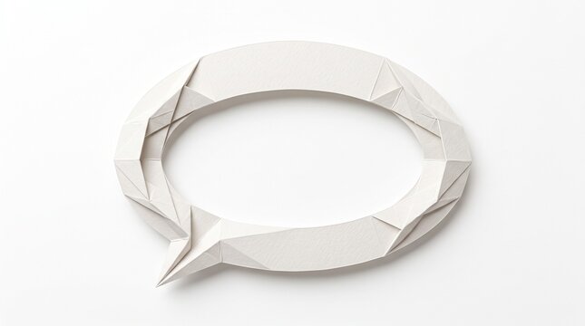 A white paper speech bubble made with complex origami technique placed on a clean light gray surface to represent communication concept