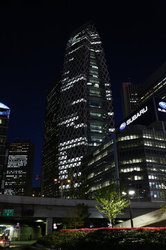 Mode Gakuen Cocoon Tower and skyscrapers illuminated at night in Shinjuku Tokyo.
