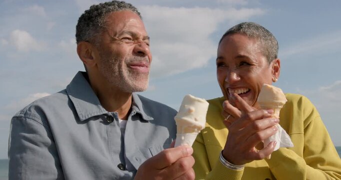 Senior Couple Laughter and joy shared over ice cream