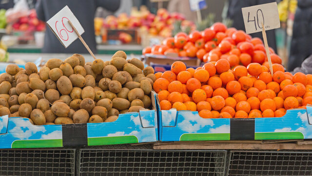 Tropical Fruits Kiwi and Tangerines at Farmers Market Stall