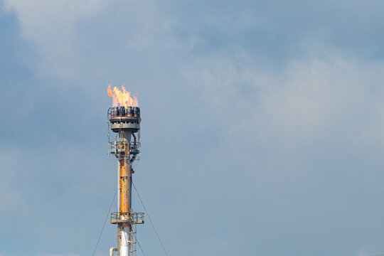 Isolated Flare Stack with Flame at an Industrial Plant along the Mississippi River in South Louisiana