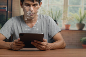 Young Man Using Digital Tablet with Virtual Interface in Modern Indoor Space © AK ST
