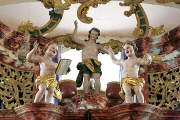 Obraz premium Angels on the organ in the Church of Saint Mary Magdalene in Cazma, Croatia