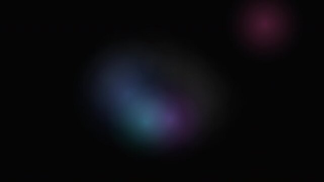 Abstract dark background with soft glowing colorful spots, blending blue and purple light effects for modern digital design