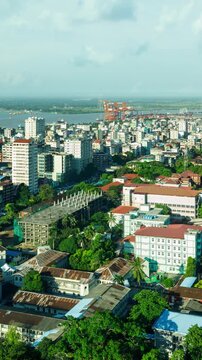 Time lapse of clouds moving over the city of Yangon Myanmar. Vertical video.