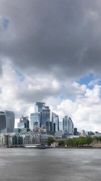 Time Lapse looking across the River Thames at the London Skyline. Vertical Video.