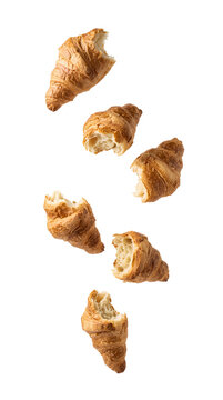 Bitten croissants flying in motion isolated. Half eaten buttery pastries falling from above png. Flaky bakery food scraps with chew marks isolated