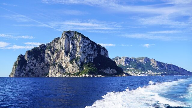 Island of Capri  with wake from ferry in the Gulf of Naples, Italy