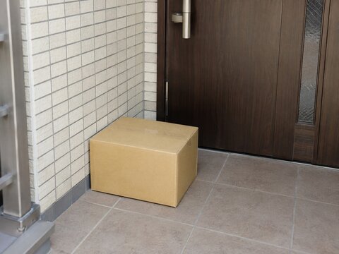 Unbranded parcel left outside an apartment door in Japan