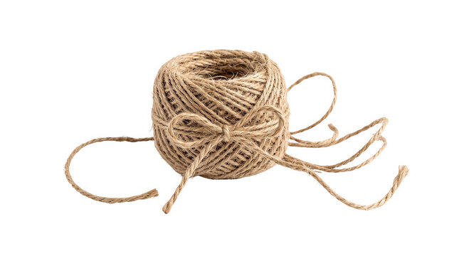 A single spool of natural brown jute twine rope for crafting and packaging projects shown as an isolated object on a transparent background isolated on transparent background