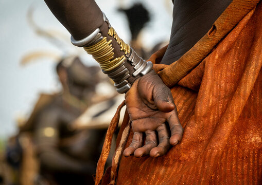 Bodi boy with umbrella at Kael ceremony, Hana, Ethiopia