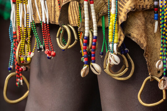 Group of Bodi men in cowhide at Kael ceremony, Hana, Ethiopia