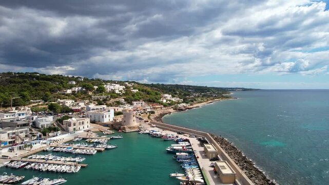 Marina di Pescoluse, Puglia &ndash; Torre Vado &ndash; aerial shot flying backwards out of the harbor