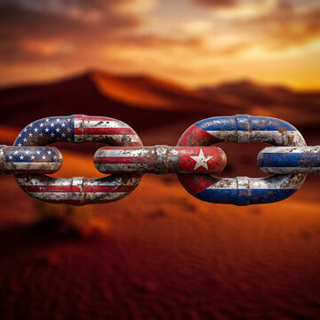 metal chain with flags of the usa and cuba is located horizontally against a desert sunset background concept of diplomatic relations embargo history of relations and geopolitical dialogue
