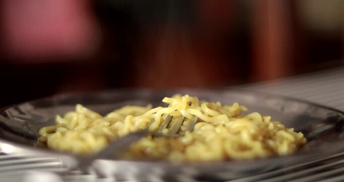 Steaming Hot Maggi Noodles Served in a Plate Close Up
