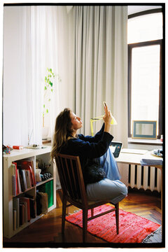 A young girl works from home