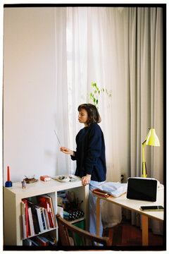 A woman lights incense