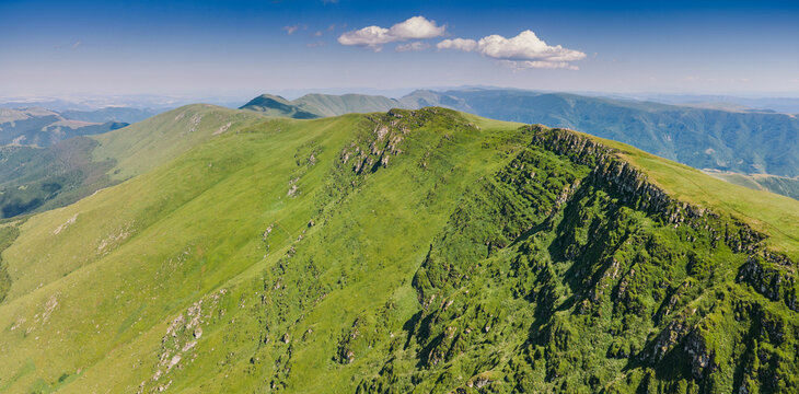 Rolling green hills and rugged mountain peaks stretching into the distance in Stara Planina park, Serbia and Bulgaria border