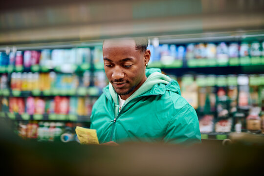 Black Man Shopping for Organic Produce in Grocery Store