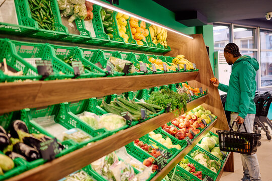 Black Man Shopping for Organic Produce in Grocery Store