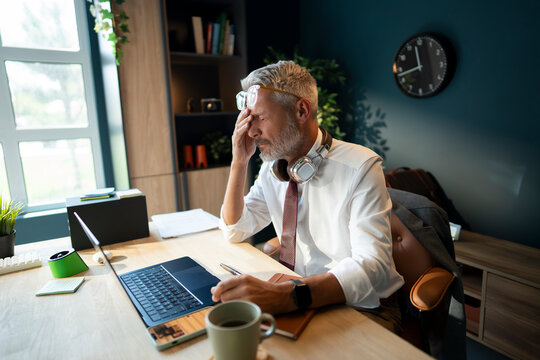 Senior Businessman Working in Office