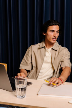 Young creative entrepreneur, working together with other professionals