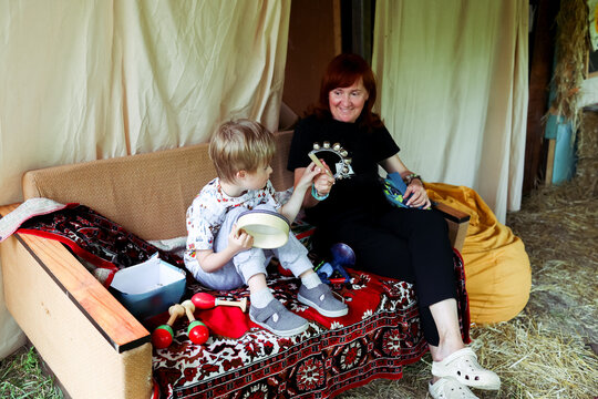 Outdoor activity with a child with Down syndrome at a camp