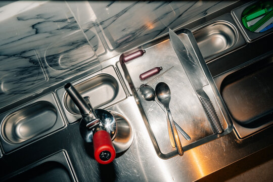 Kitchen Workspace With Utensils and Tools During Preparation