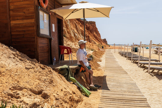 Traveler arriving at beach in Albufeira during summer vacation
