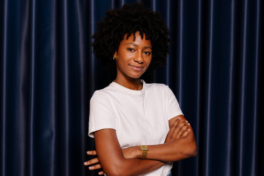 A medium-shot portrait of a young Black woman