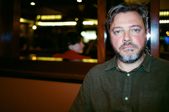 Close up flash portrait in a bar at night