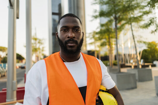 Black man construction worker wearing safety vest
